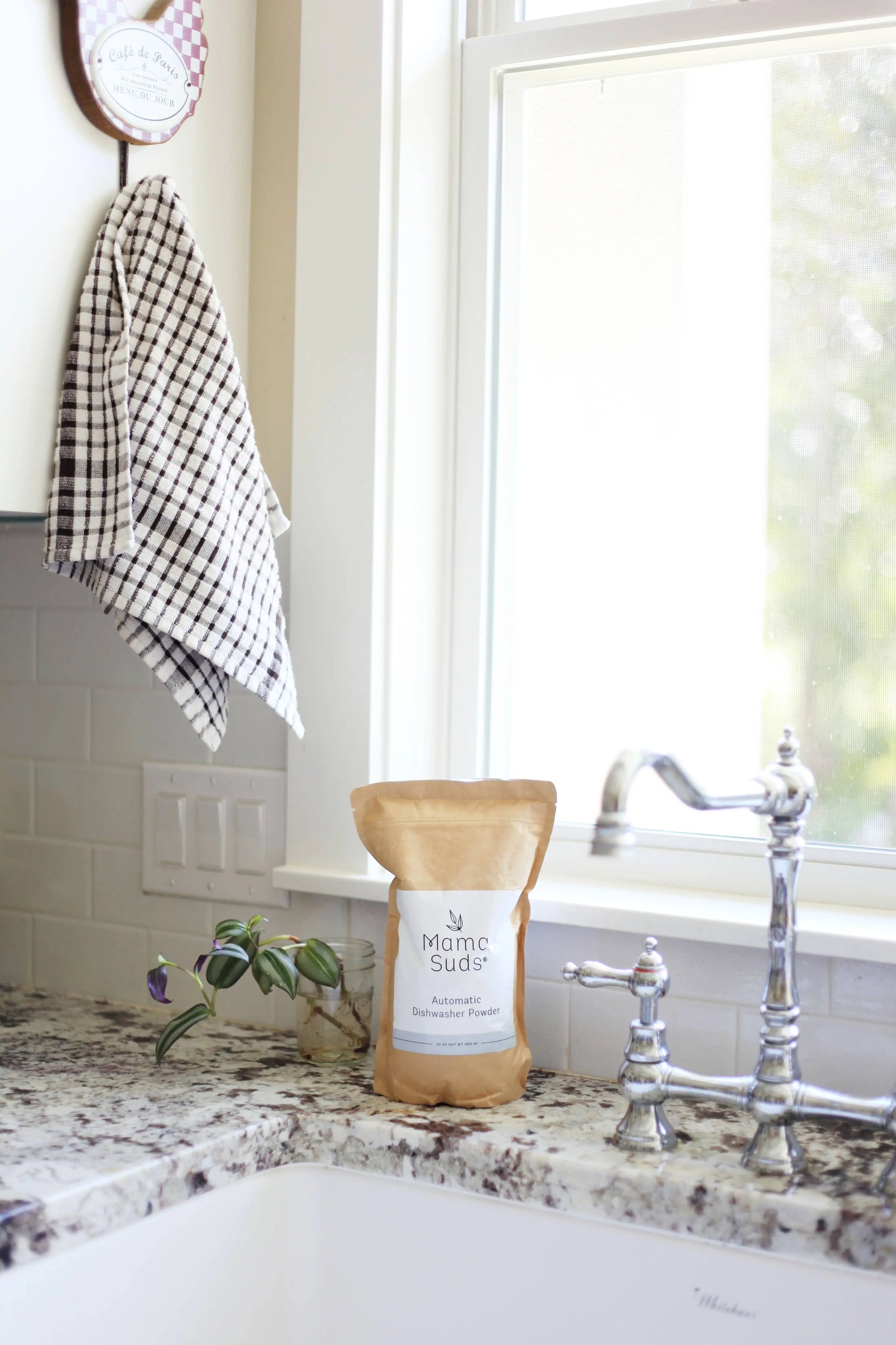 Nice picture of Mama Suds Automatic Dishwashing Powder sitting next to a tastefully retro kitchen sink