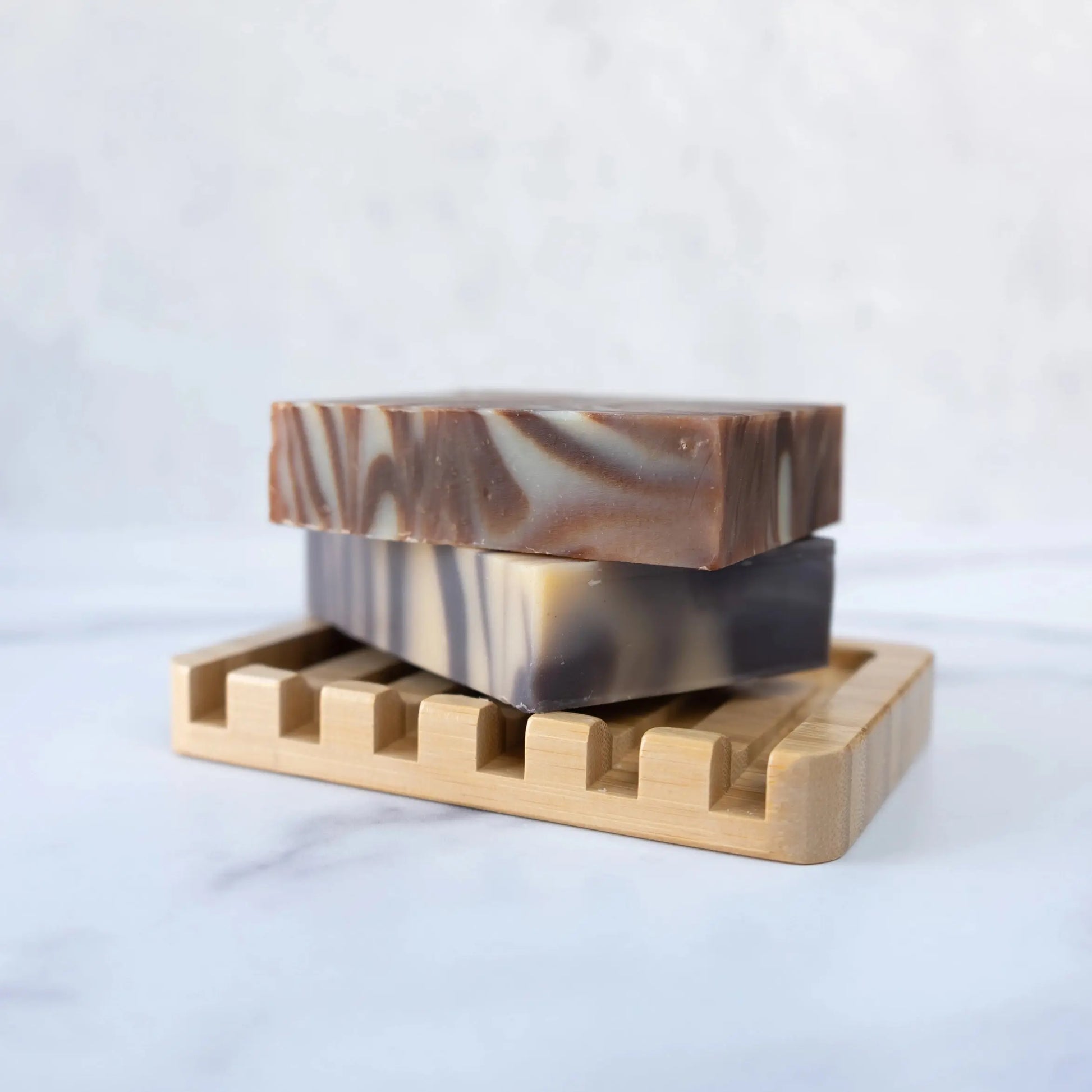 Bamboo Waterfall Self-Draining Soap Dish with two artisanal soap bars stacked on top of the dish| Eco Friendly Earth Ahead